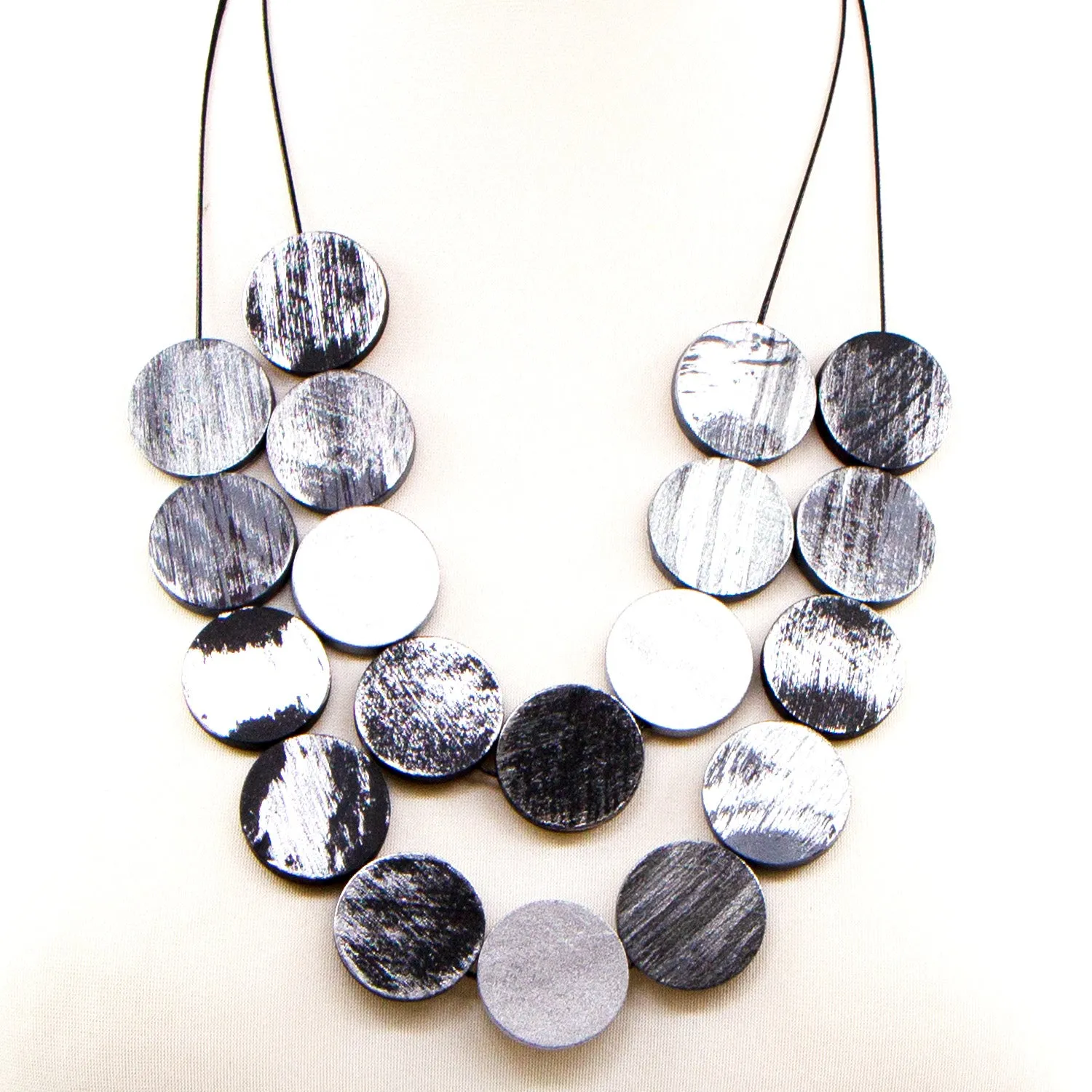 Flat round wood and resin double strand necklace with brush stroke effect
