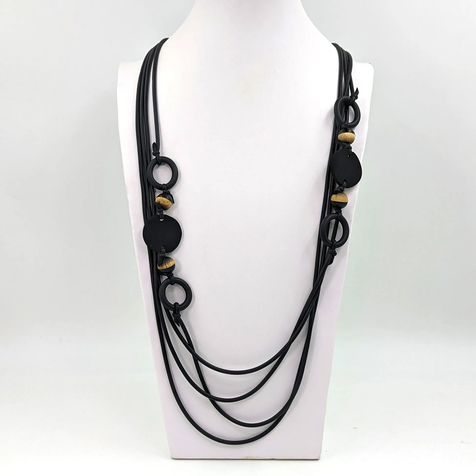 Four strand long neoprene necklace with wood beads, discs and links
