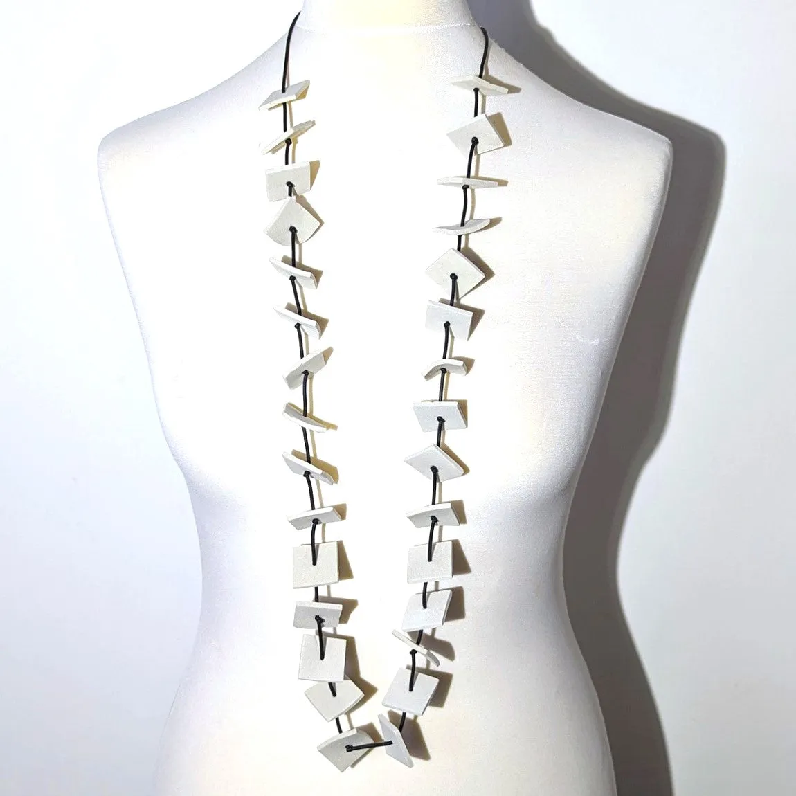 Lightweight necklace with neoprene squares and knotted spacing